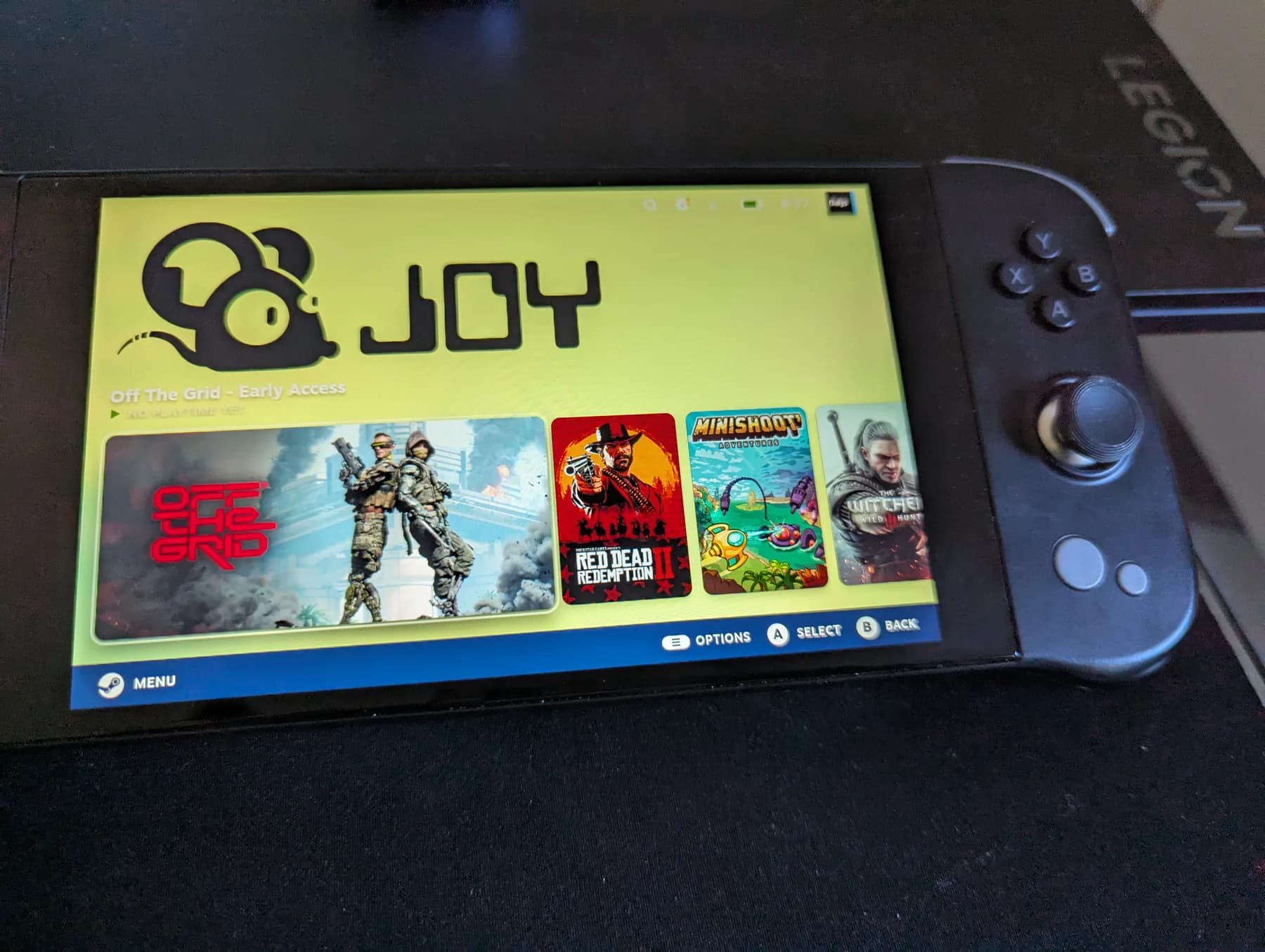 JOY Genesis prototype running JOY GAME OS, showing a library of PC games